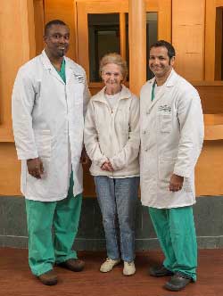 Moses deGraft-Johnson, MD, Margie Allen, and Ajay Mhatre, MD pose for a picture